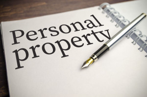 personal property words on white notepad and pen