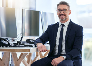 Portrait of computer information technology manager, software programmer or business man engineer. Trust, leadership and vision of an IT man in company cybersecurity management with smile for success